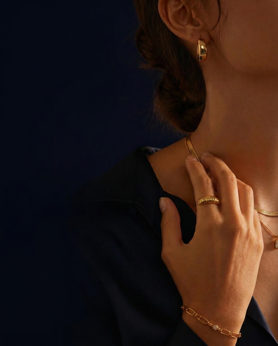 Model wearing layered POKA necklaces, ring, earring and bracelet